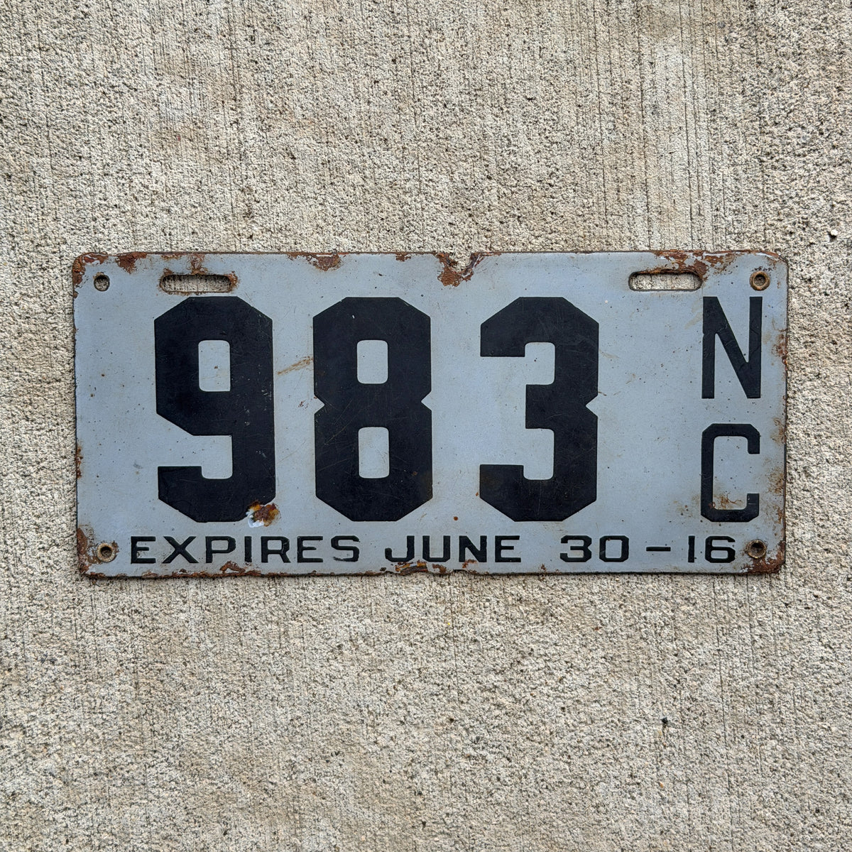 Photo of a 1915 1916 North Carolina Porcelain License Plate Auto Tag Garage Decor Vintage Low Number Three Digit 983 with original patina