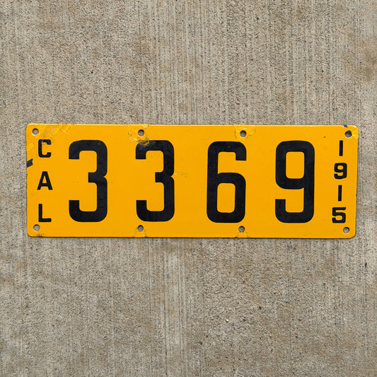 Photo of a 1915 California Porcelain License Plate Auto Tag Garage Decor Vintage Low Number Four Digit 3369 with original patina