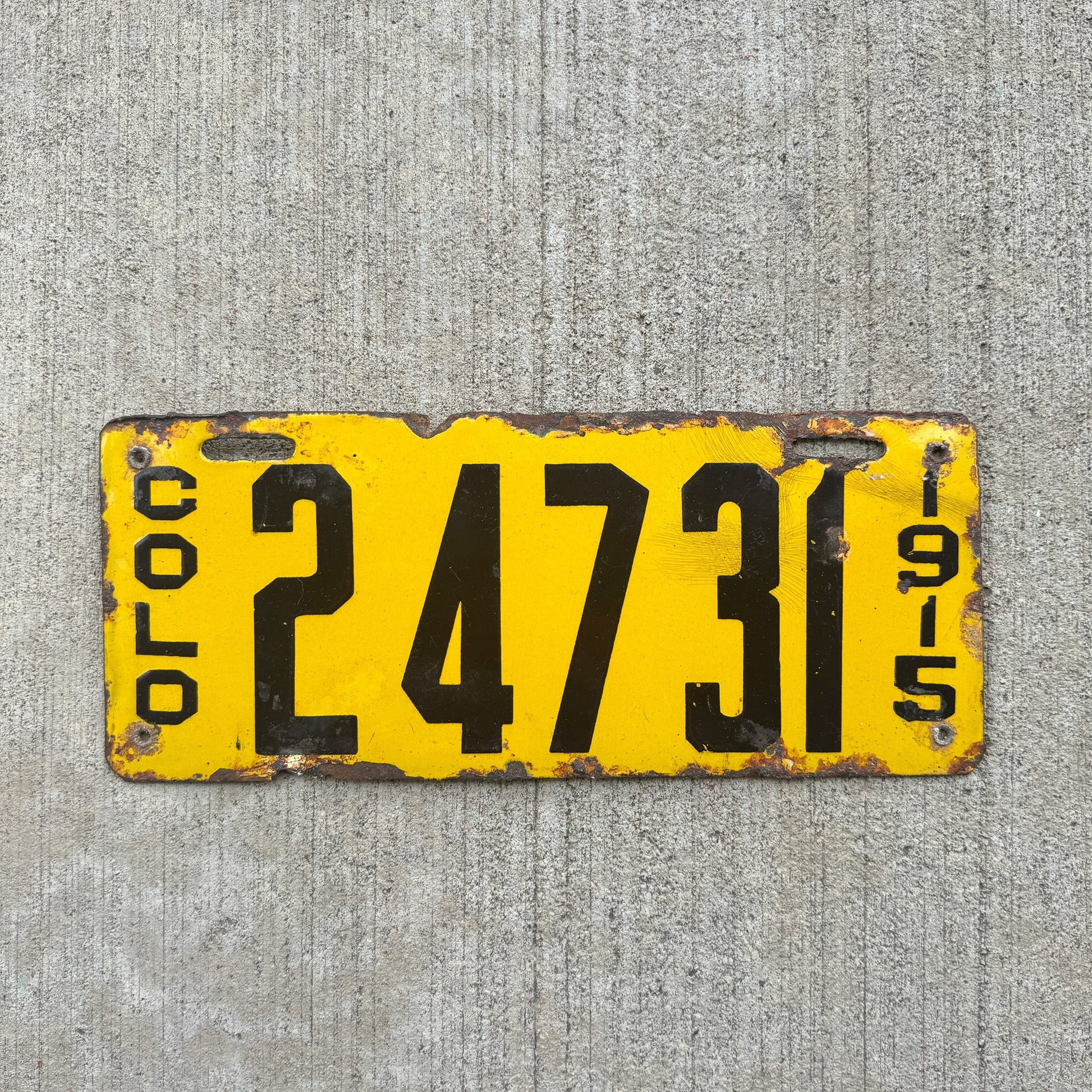 Photo of a 1915 Colorado Porcelain License Plate Auto Tag Garage Decor Vintage 24731 with original patina