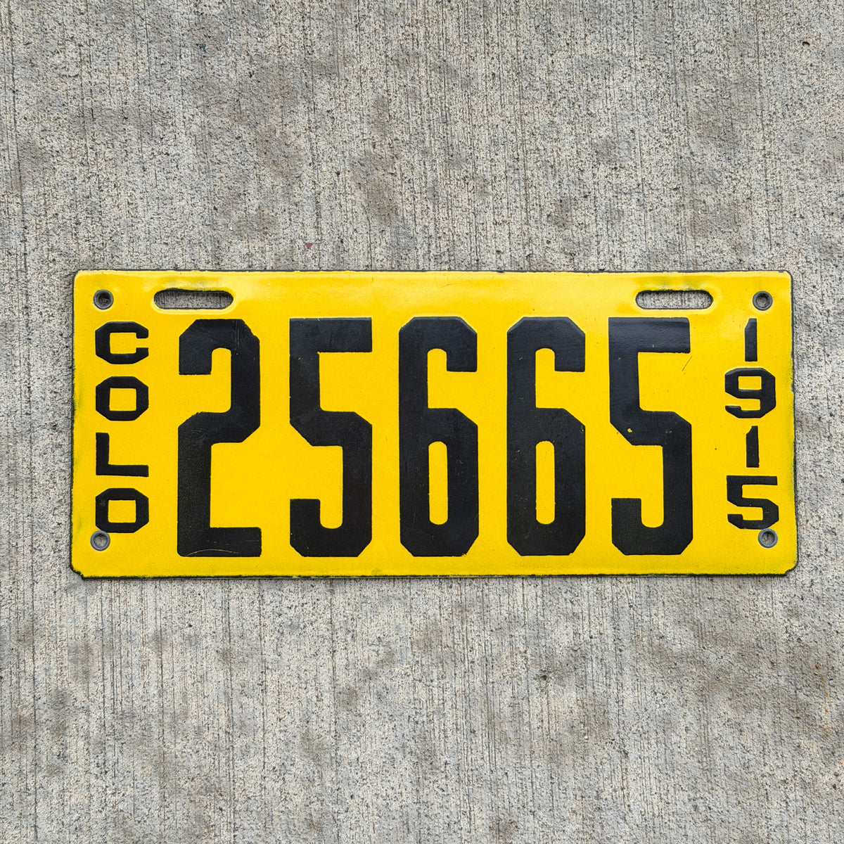 Photo of a 1915 Colorado Porcelain License Plate Auto Tag Garage Decor Vintage High Quality 25665 with original patina