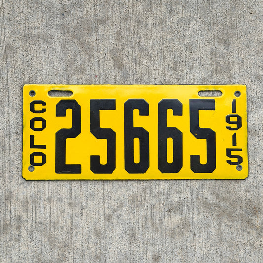Photo of a 1915 Colorado Porcelain License Plate Auto Tag Garage Decor Vintage High Quality 25665 with original patina