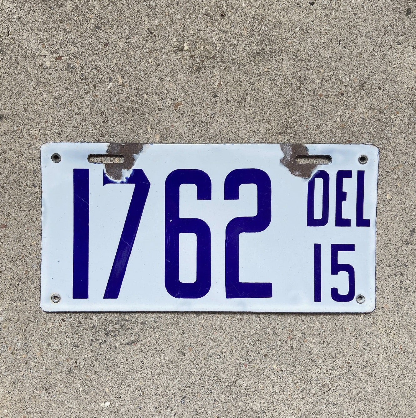 Photo of a 1915 Delaware Porcelain License Plate Auto Tag Garage Decor Vintage High Quality 1762 with original patina