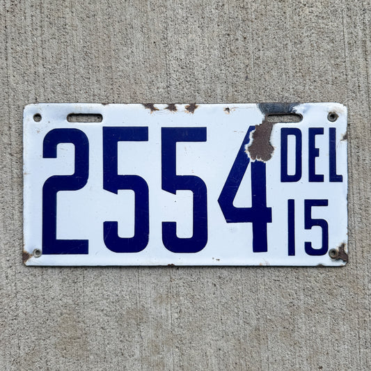 Photo of a 1915 Delaware Porcelain License Plate Auto Tag Garage Decor Vintage Low Number Four Digit 2554 with original patina