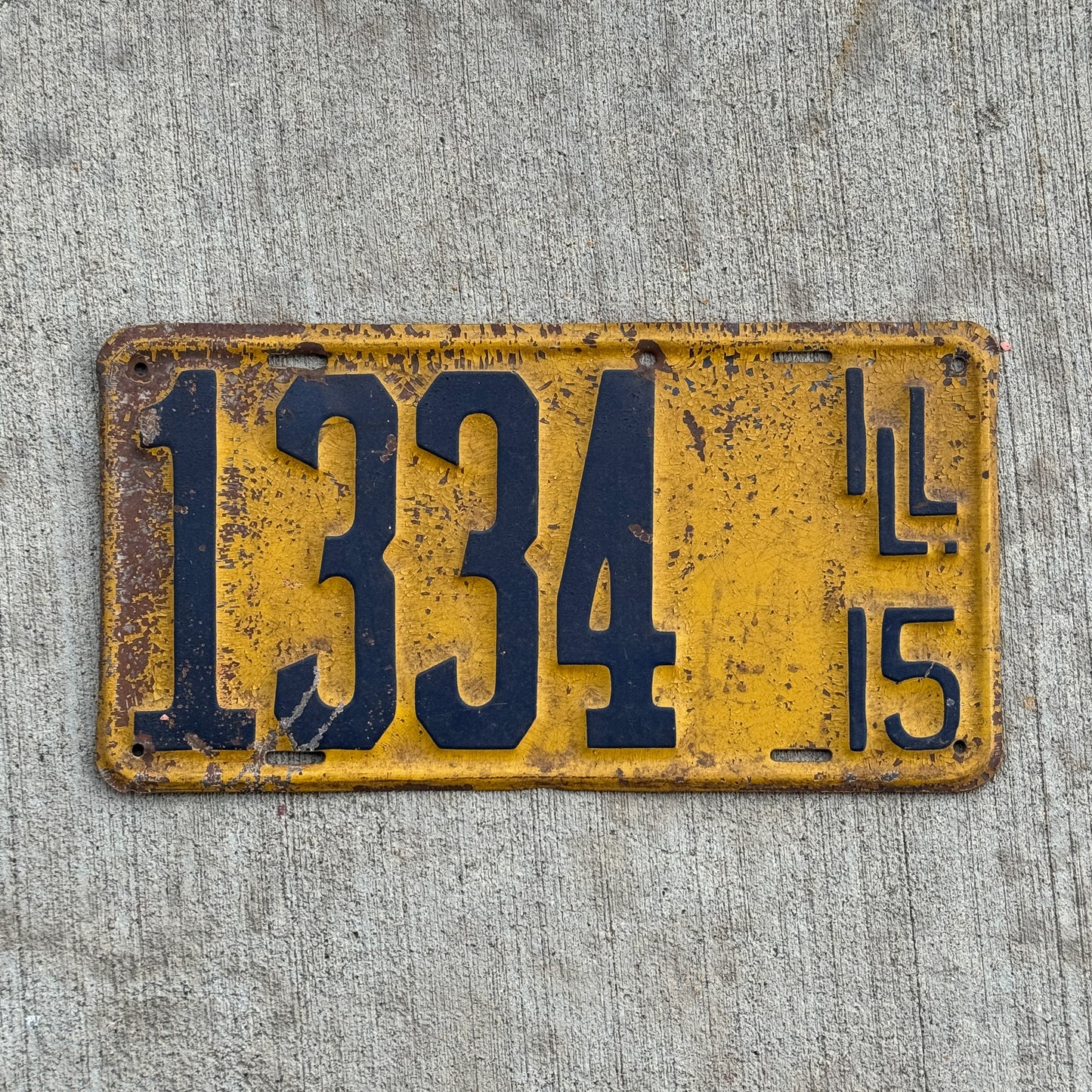 Photo of a 1915 Illinois License Plate Auto Tag Garage Decor Vintage 1334 with original patina