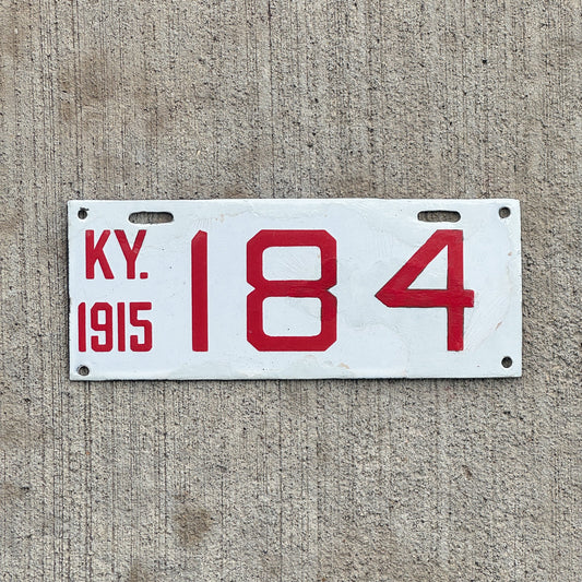 Photo of a 1915 Kentucky Porcelain Motorcycle License Plate Auto Tag Garage Decor Vintage 184 with original patina
