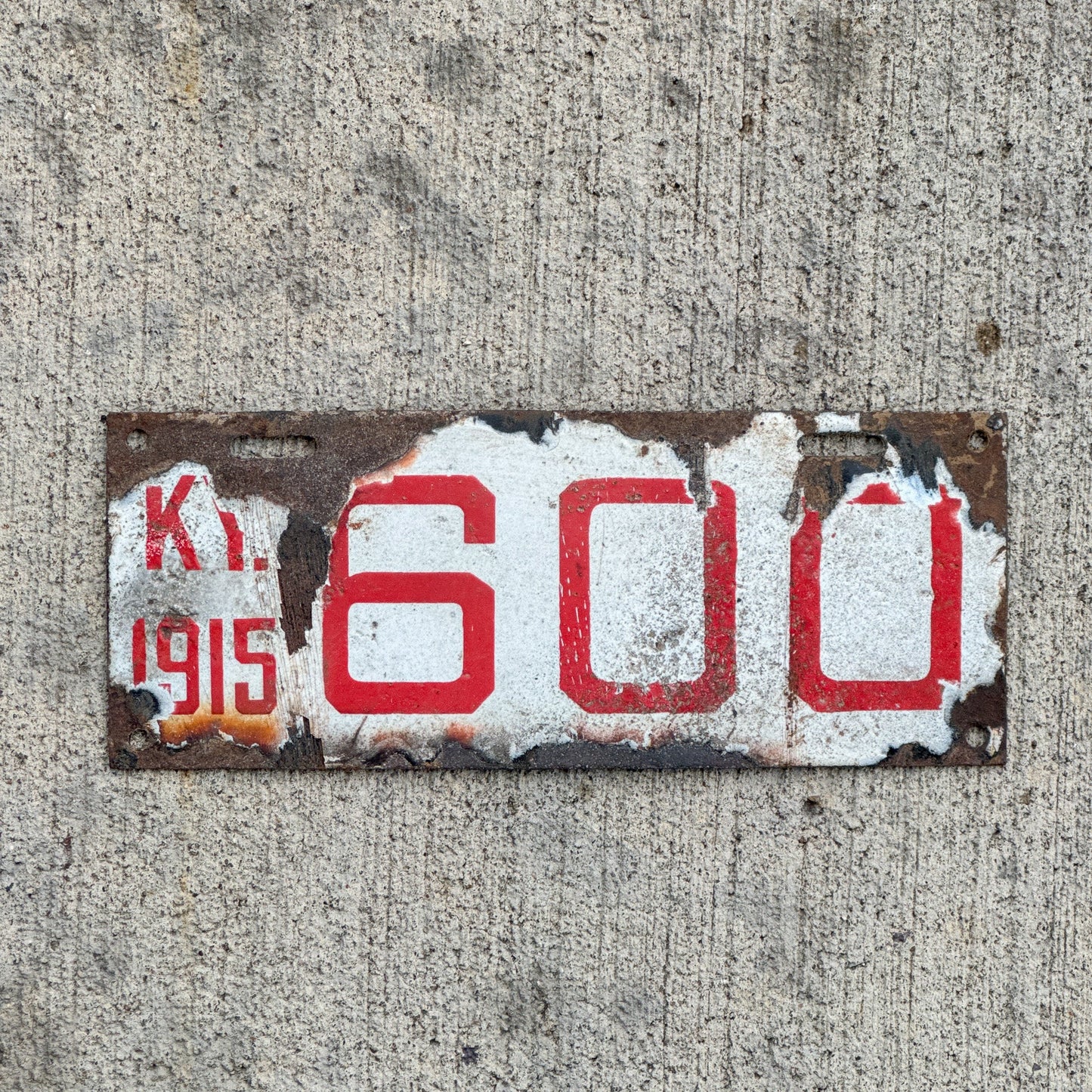 Photo of a 1915 Kentucky Porcelain Motorcycle License Plate Auto Tag Garage Decor Vintage 2nd Year Only Porcelain Low Number Three Digit 600 with original patina