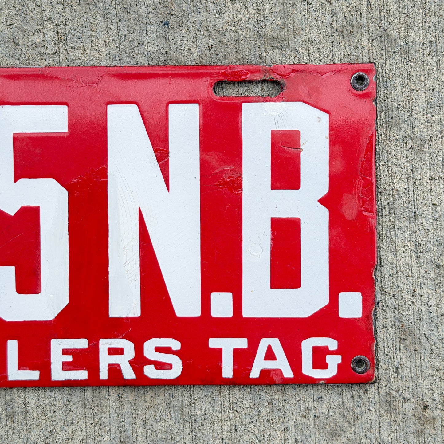 Photo of a 1915 New Brunswick Porcelain Dealer License Plate Auto Tag Garage Decor Vintage Low Number Two Digit 65 with original patina