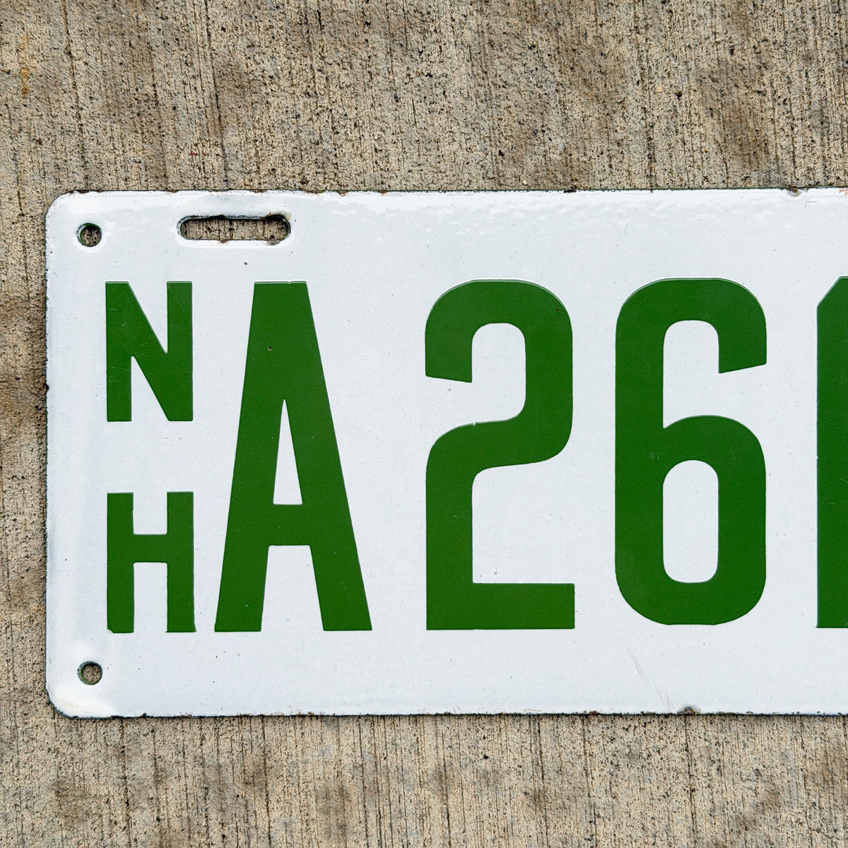 Photo of a 1915 New Hampshire Porcelain Dealer License Plate Auto Tag Garage Decor Vintage High Quality A 261 C with original patina