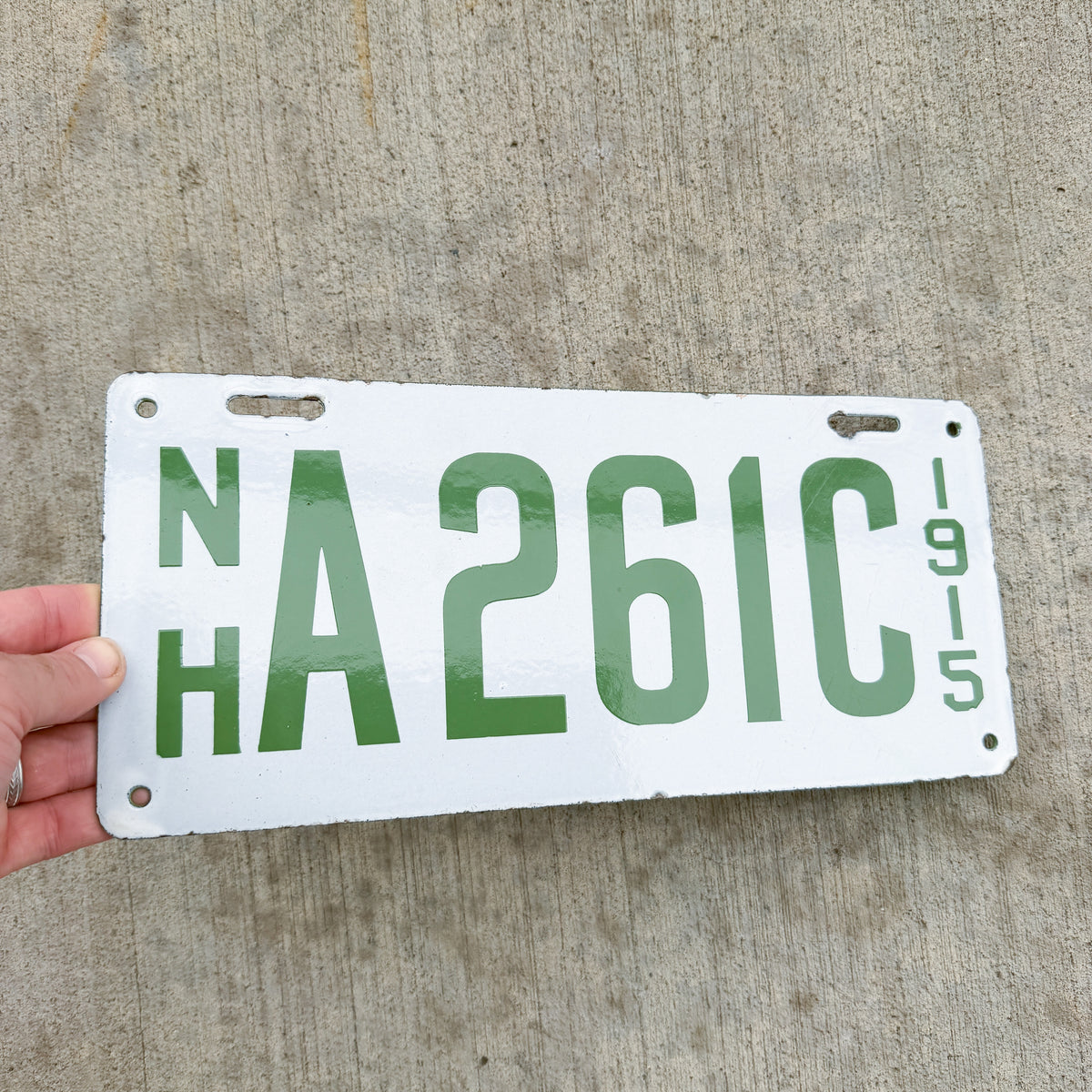 Photo of a 1915 New Hampshire Porcelain Dealer License Plate Auto Tag Garage Decor Vintage High Quality A 261 C with original patina