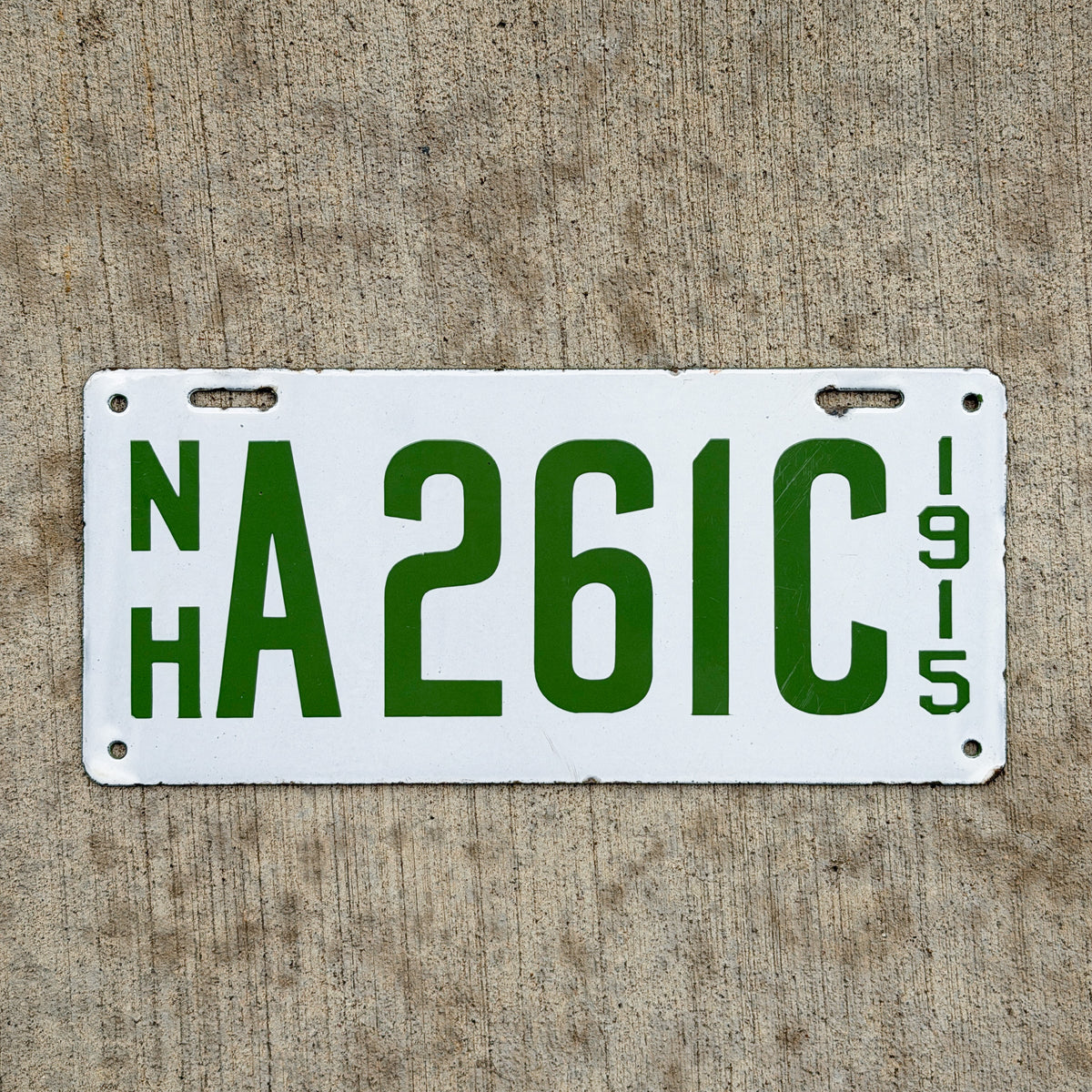 Photo of a 1915 New Hampshire Porcelain Dealer License Plate Auto Tag Garage Decor Vintage High Quality A 261 C with original patina