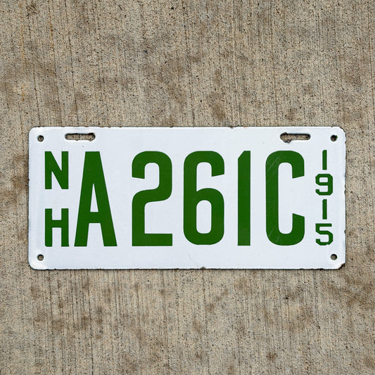 Photo of a 1915 New Hampshire Porcelain Dealer License Plate Auto Tag Garage Decor Vintage High Quality A 261 C with original patina