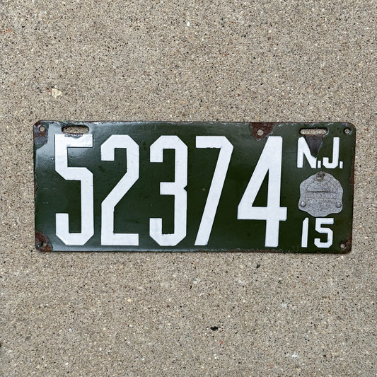 Photo of a 1915 New Jersey Porcelain License Plate Auto Tag Garage Decor Vintage 52374 with original patina