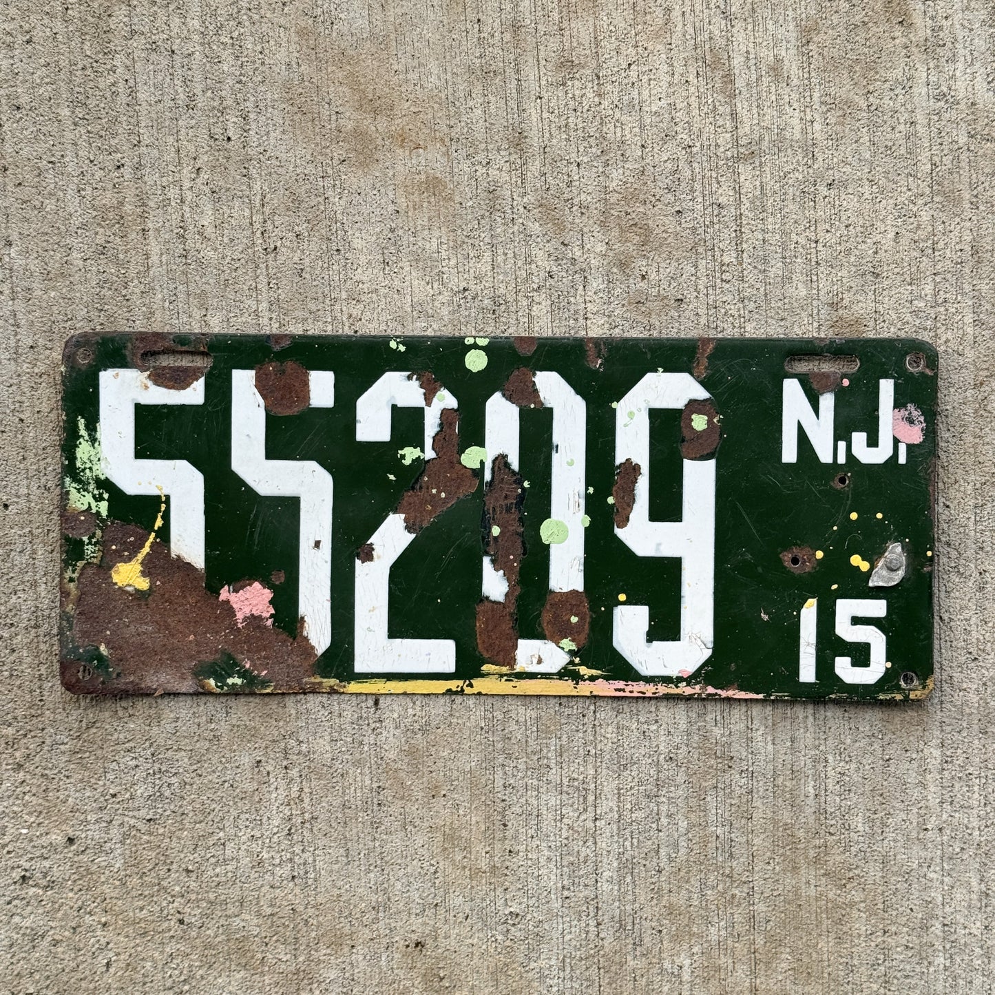 Photo of a 1915 New Jersey Porcelain License Plate Auto Tag Garage Decor Vintage 55209 with original patina