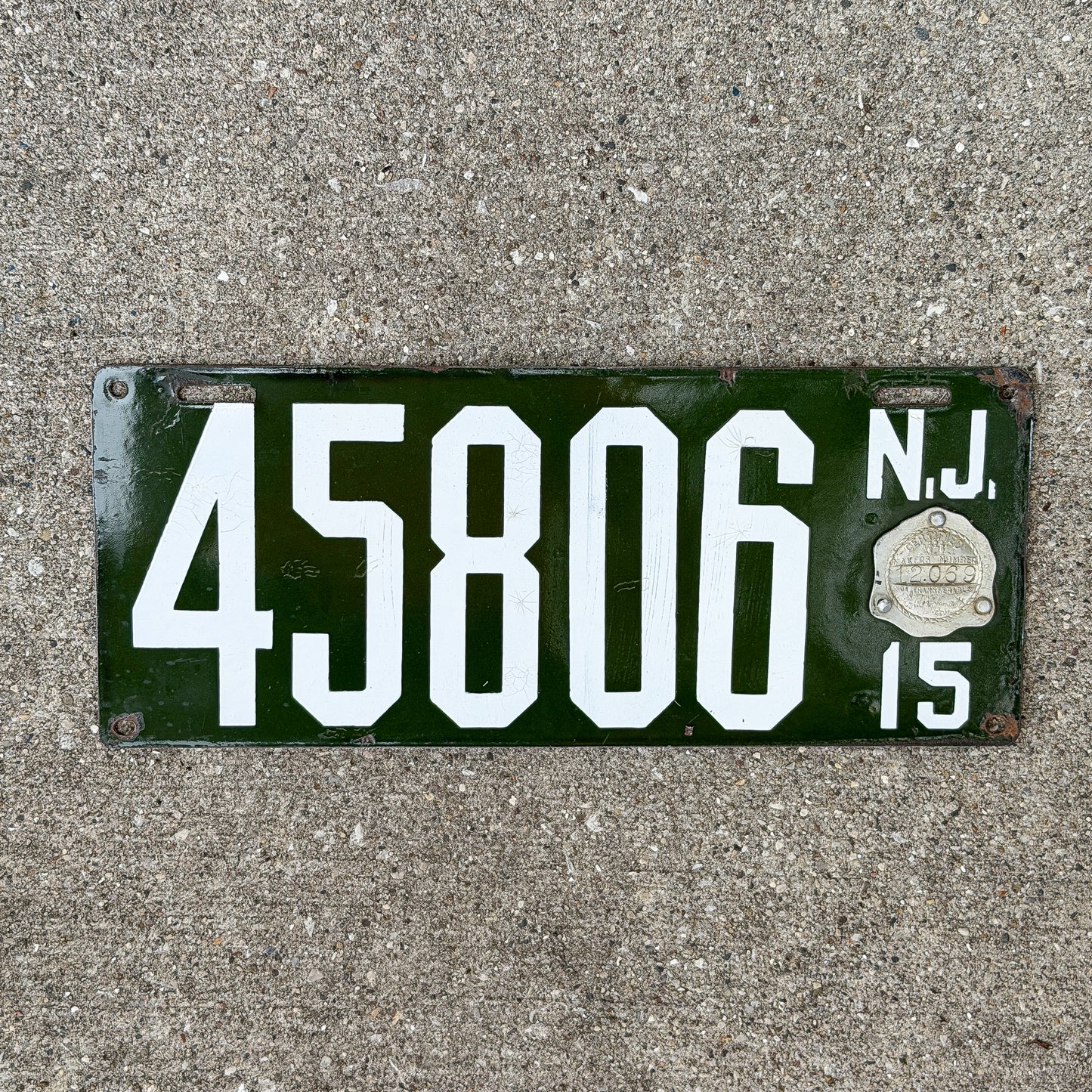 Photo of a 1915 New Jersey Porcelain License Plate Auto Tag Garage Decor Vintage Nice Quality Glossy 45806 with original patina