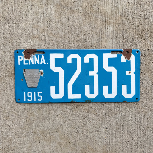 Photo of a 1915 Pennsylvania Porcelain License Plate Auto Tag 2 Vintage Garage Blue Back Type 52353 with original patina