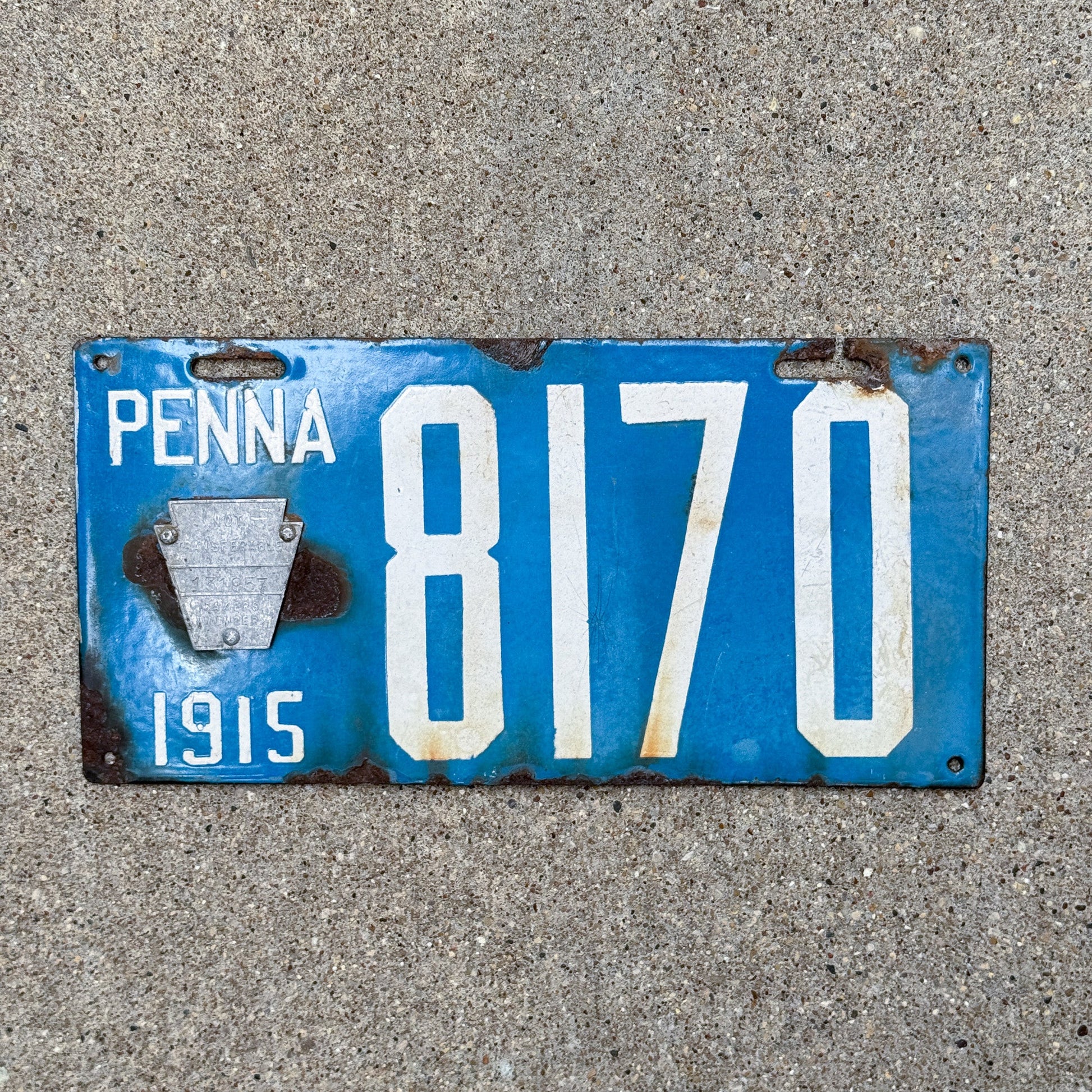 Photo of a 1915 Pennsylvania Porcelain License Plate Auto Tag Garage Decor Vintage Low Number Four Digit 8170 with original patina