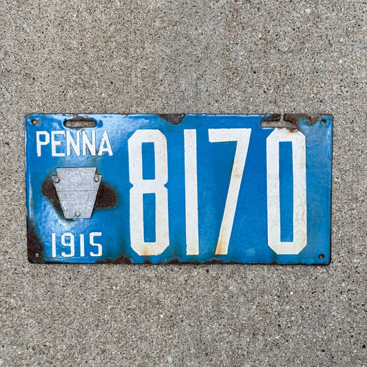 Photo of a 1915 Pennsylvania Porcelain License Plate Auto Tag Garage Decor Vintage Low Number Four Digit 8170 with original patina