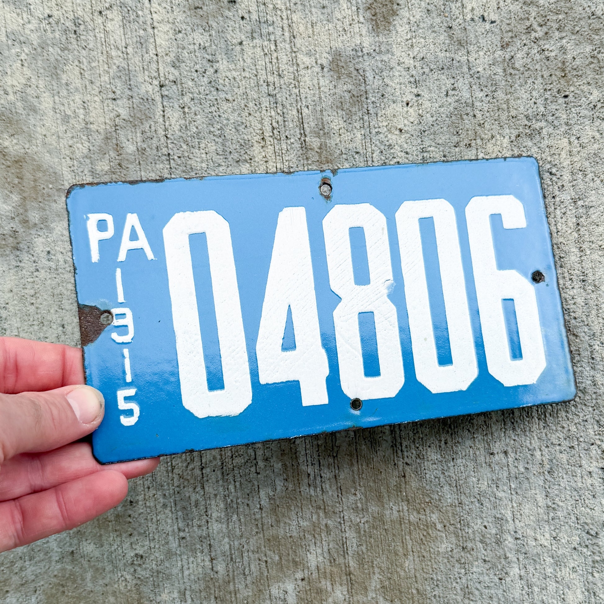 Photo of a 1915 Pennsylvania Porcelain Motorcycle License Plate Auto Tag Garage Decor Vintage Porcelain 04806 with original patina