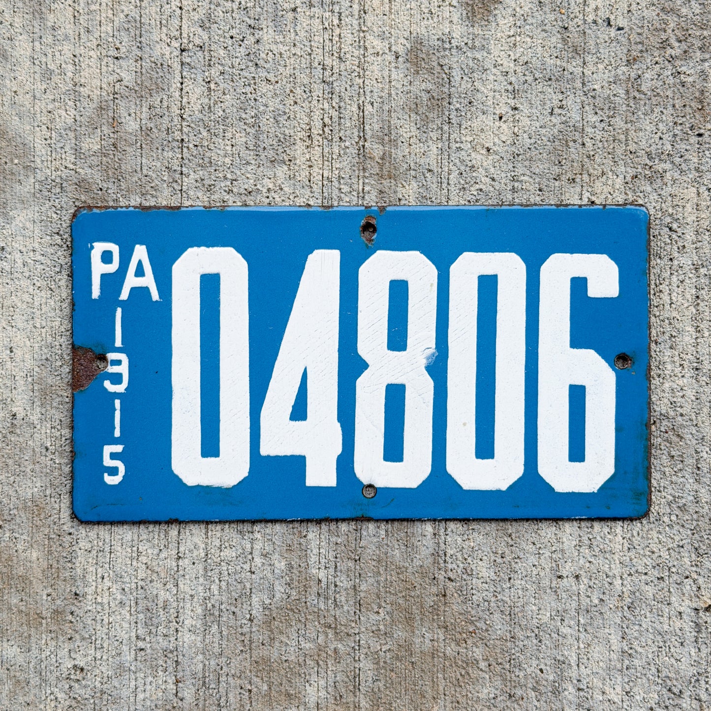 Photo of a 1915 Pennsylvania Porcelain Motorcycle License Plate Auto Tag Garage Decor Vintage Porcelain 04806 with original patina