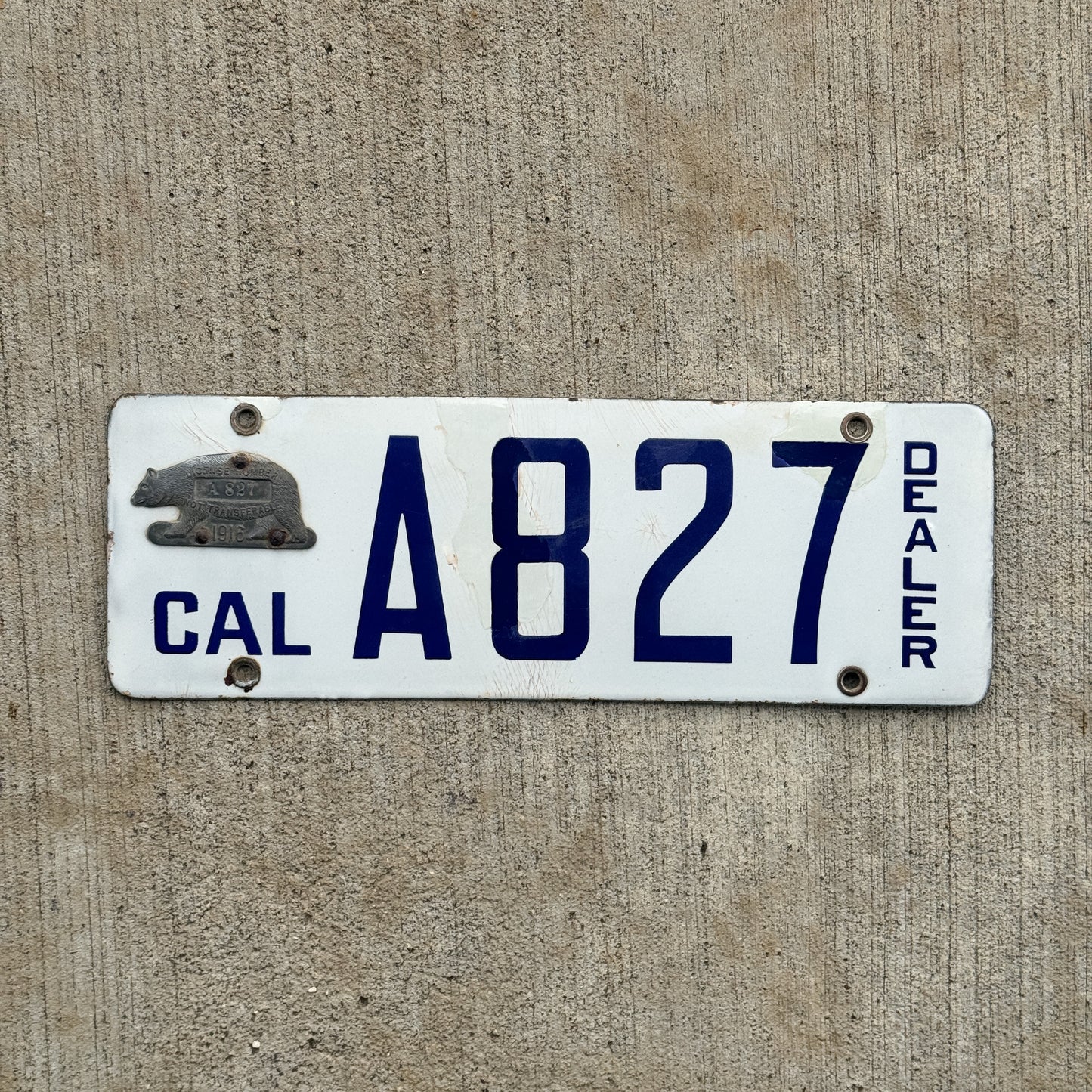 Photo of a 1916 California Porcelain Dealer License Plate Auto Tag Garage Decor Vintage High Quality A 827 with original patina