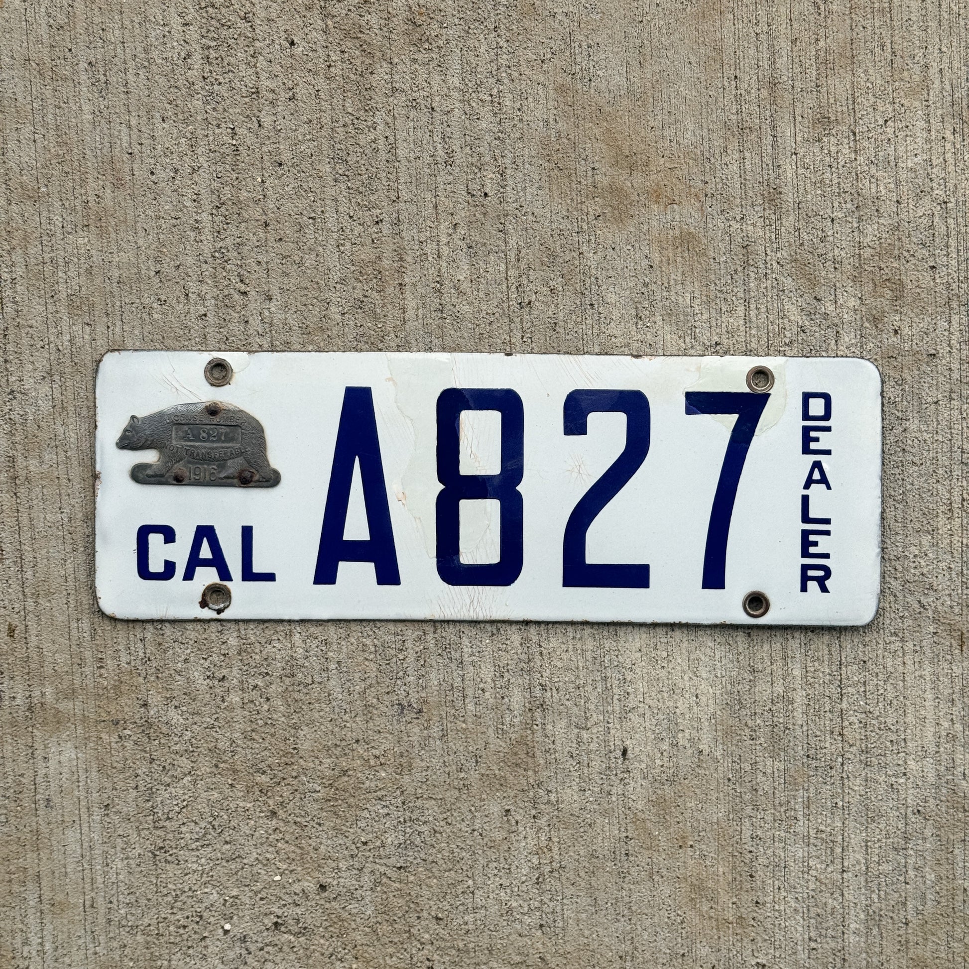 Photo of a 1916 California Porcelain Dealer License Plate Auto Tag Garage Decor Vintage High Quality A 827 with original patina