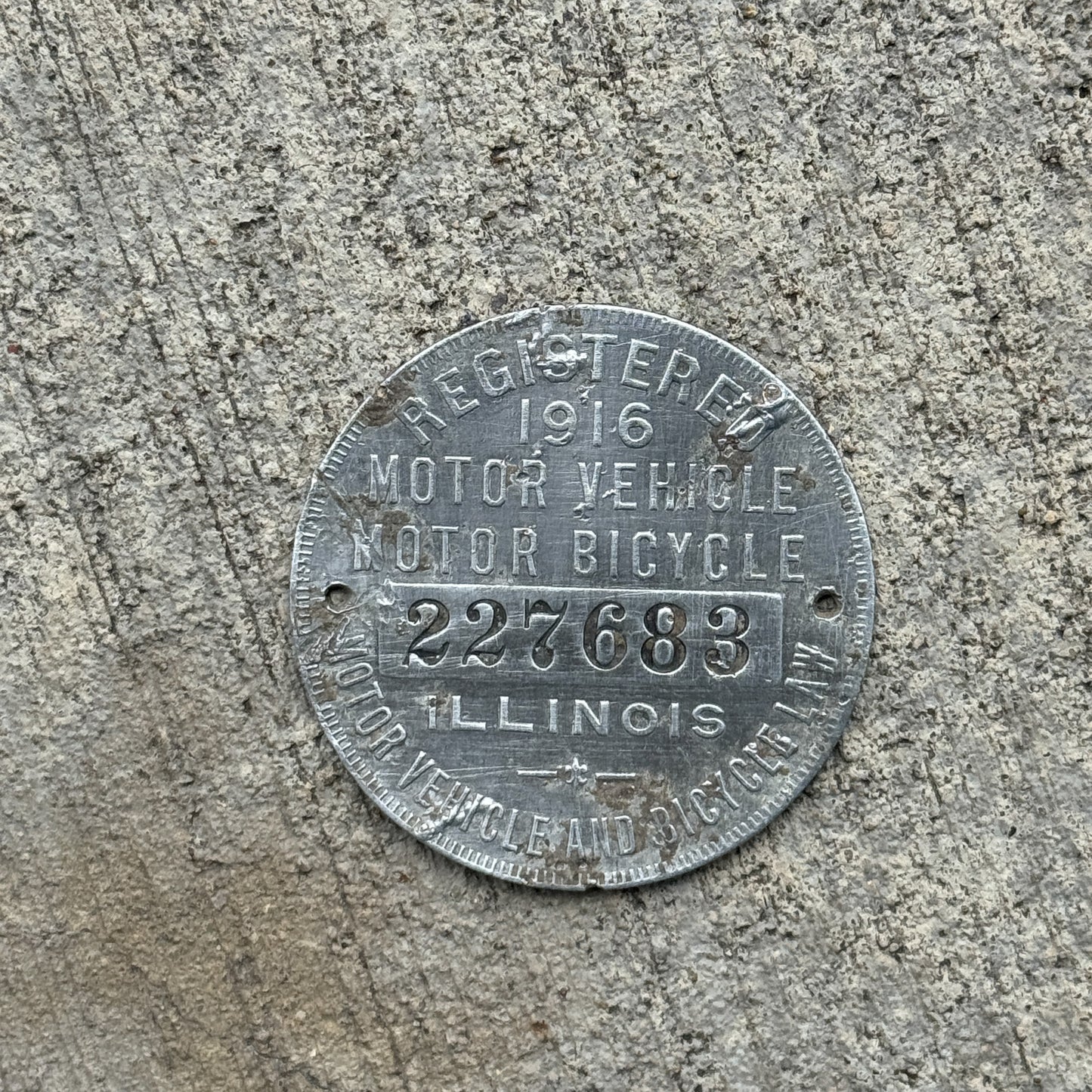 Photo of a 1916 Illinois Dashboard Disc Auto Tag Garage Decor Vintage Dash Disk 227683 with original patina