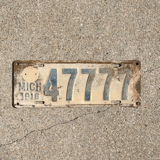 Photo of a 1916 Michigan License Plate Auto Tag Garage Decor Vintage Lucky 7 Repeat Repeating 47777 with original patina