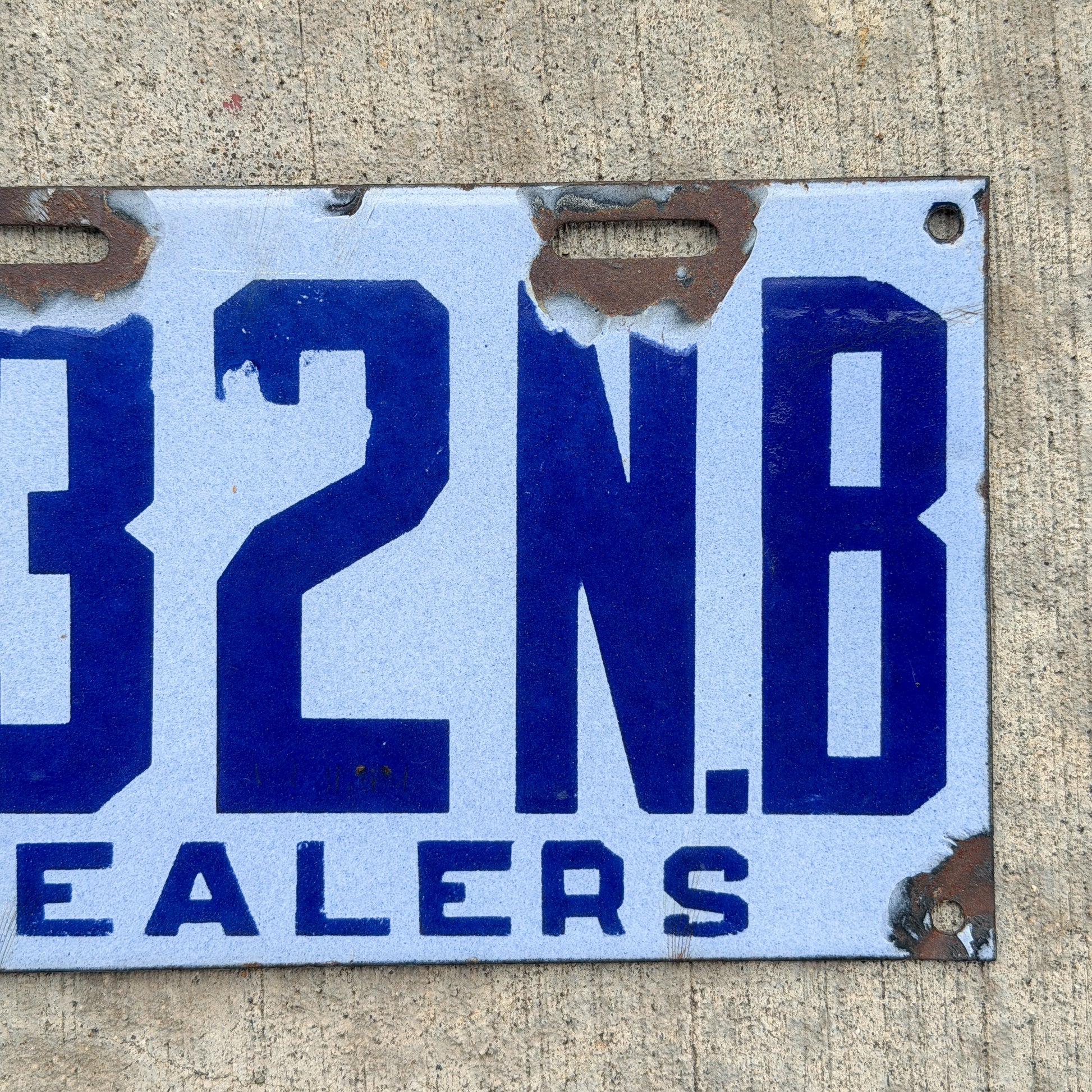 Photo of a 1916 New Brunswick Porcelain Dealer License Plate Auto Tag Garage Decor Vintage High Quality 132 with original patina