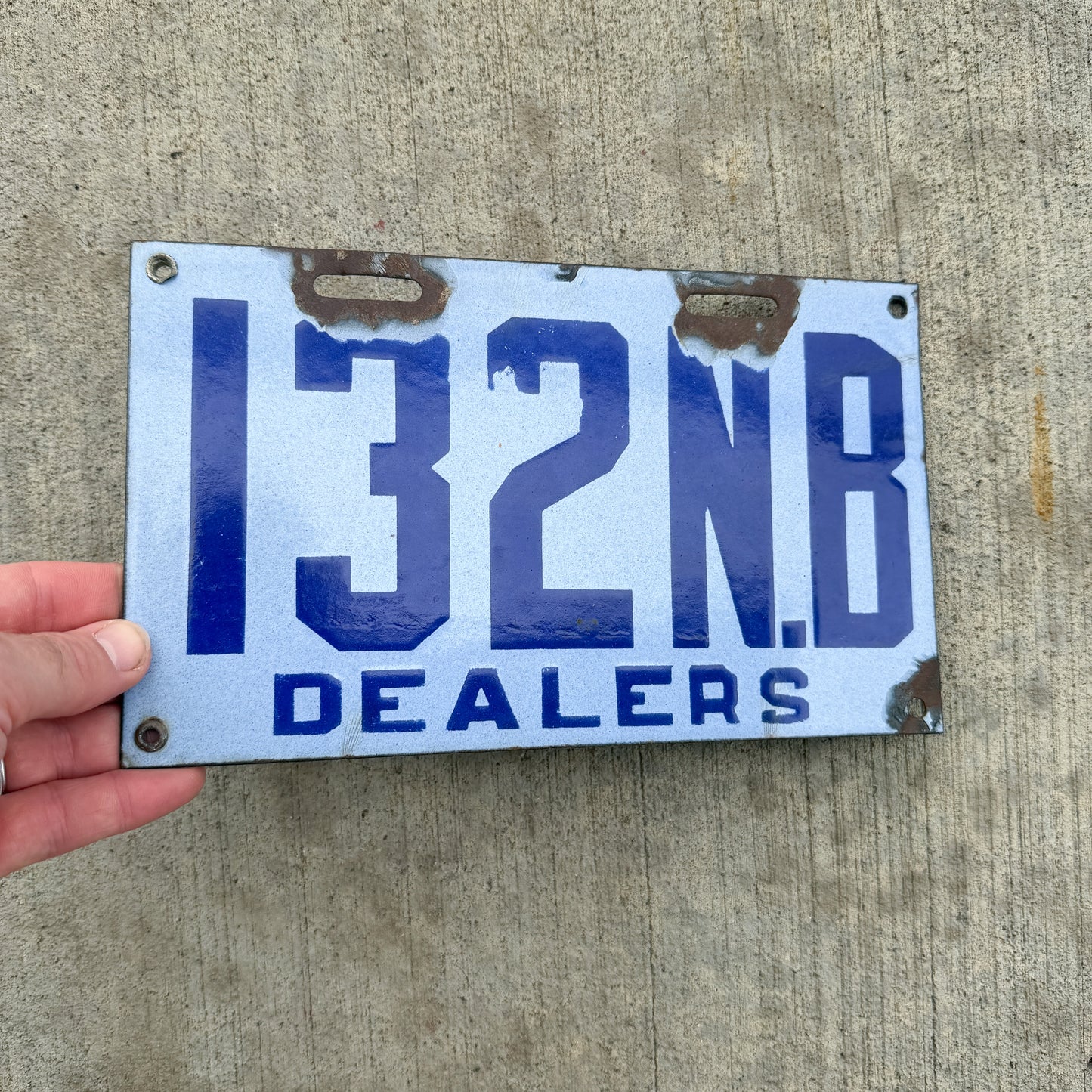 Photo of a 1916 New Brunswick Porcelain Dealer License Plate Auto Tag Garage Decor Vintage High Quality 132 with original patina