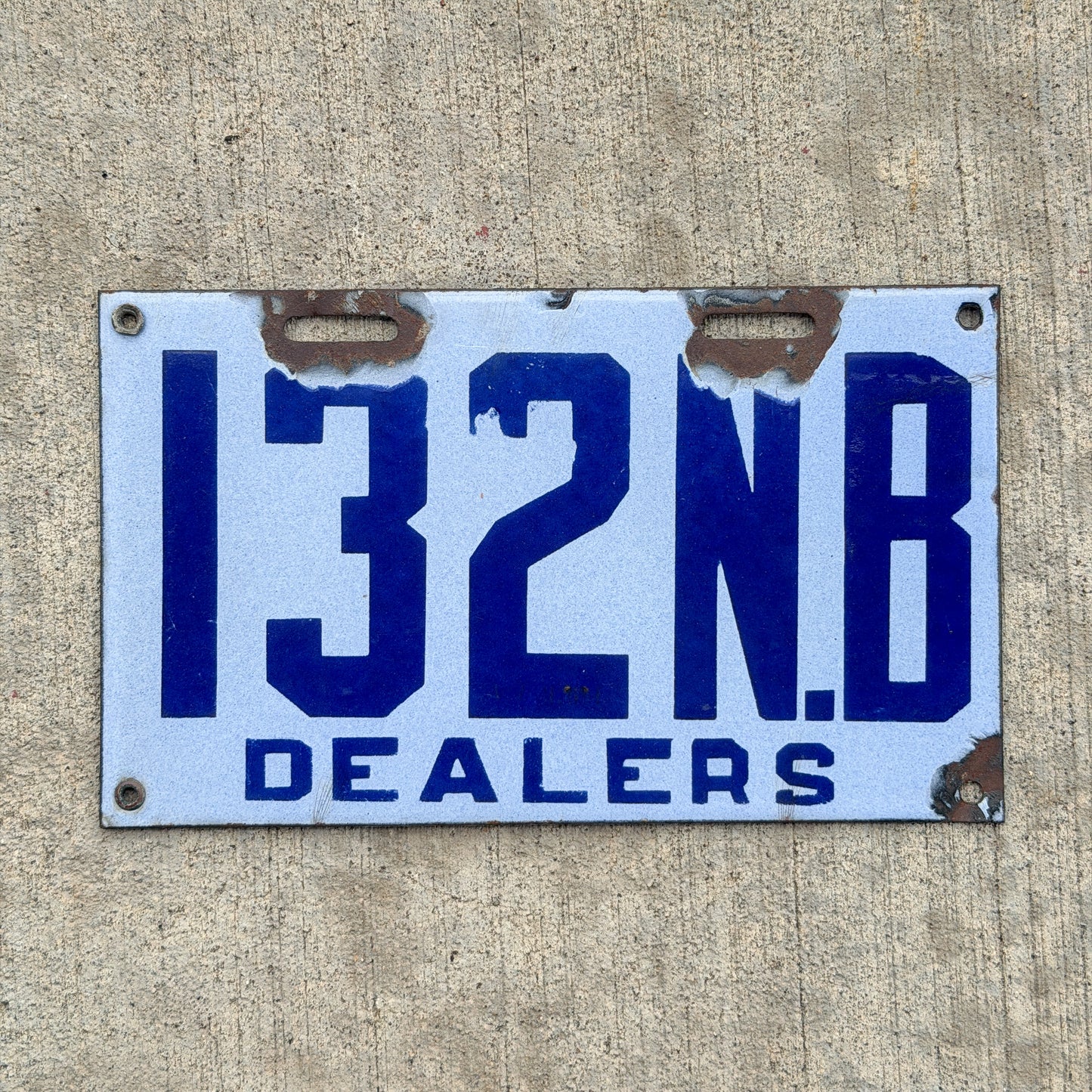 Photo of a 1916 New Brunswick Porcelain Dealer License Plate Auto Tag Garage Decor Vintage High Quality 132 with original patina