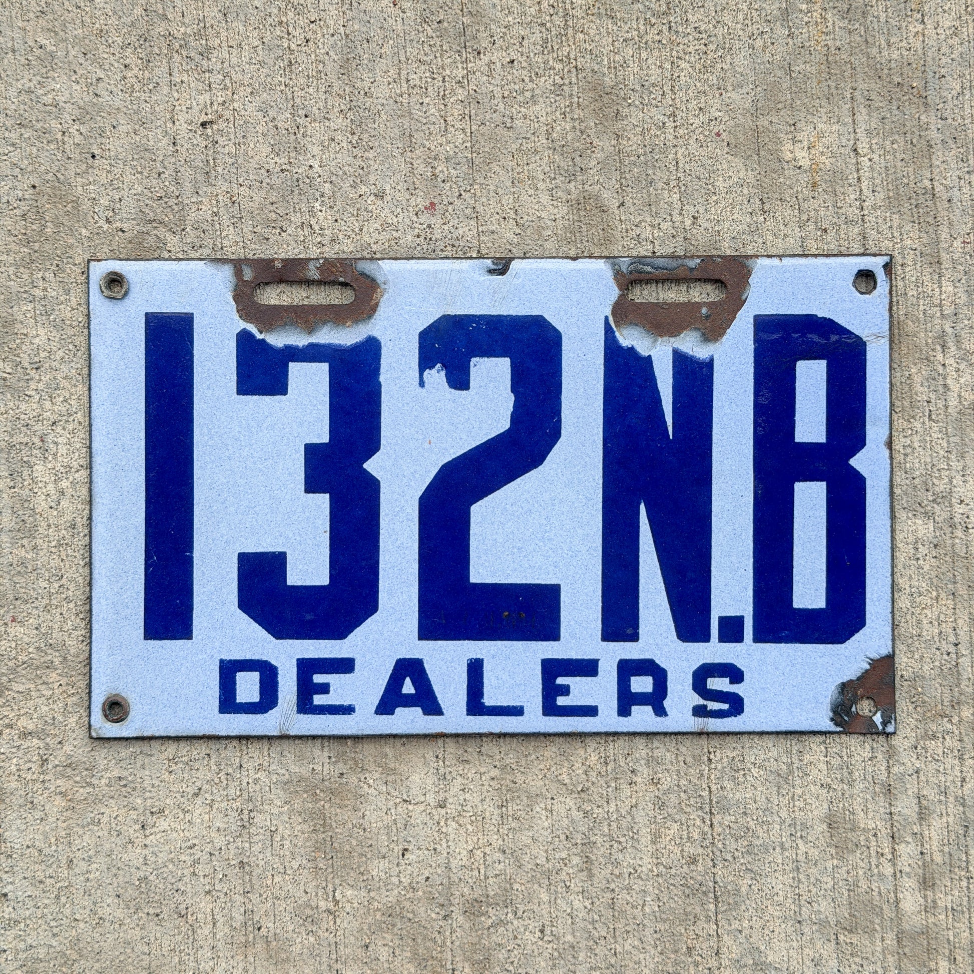Photo of a 1916 New Brunswick Porcelain Dealer License Plate Auto Tag Garage Decor Vintage High Quality 132 with original patina