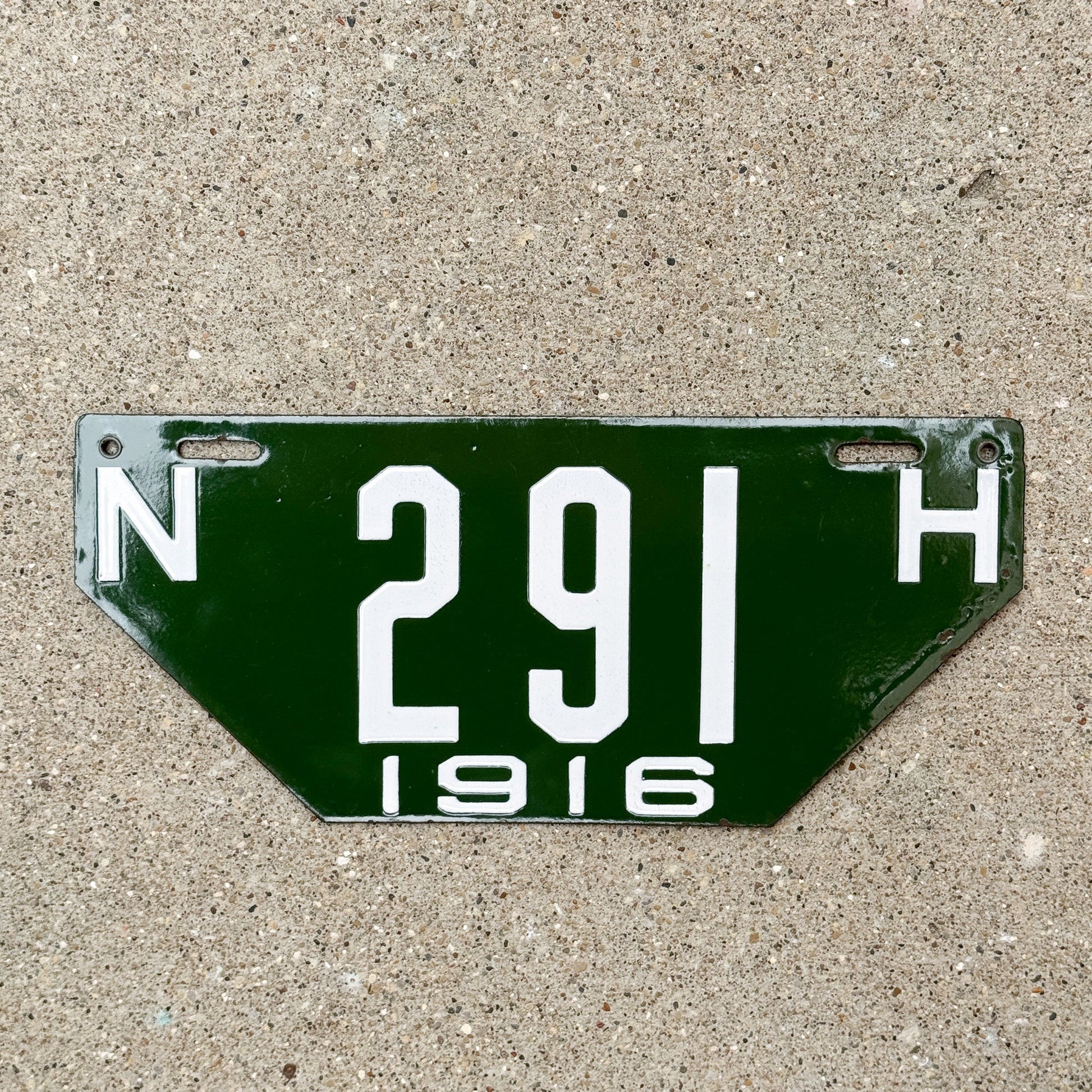 Photo of a 1916 New Hampshire Porcelain Visitor License Plate Auto Tag Garage Decor Vintage Non Resident 291 with original patina