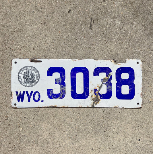 Photo of a 1916 Wyoming Porcelain License Plate Auto Tag Garage Decor Vintage Low Number Four Digit 3038 with original patina