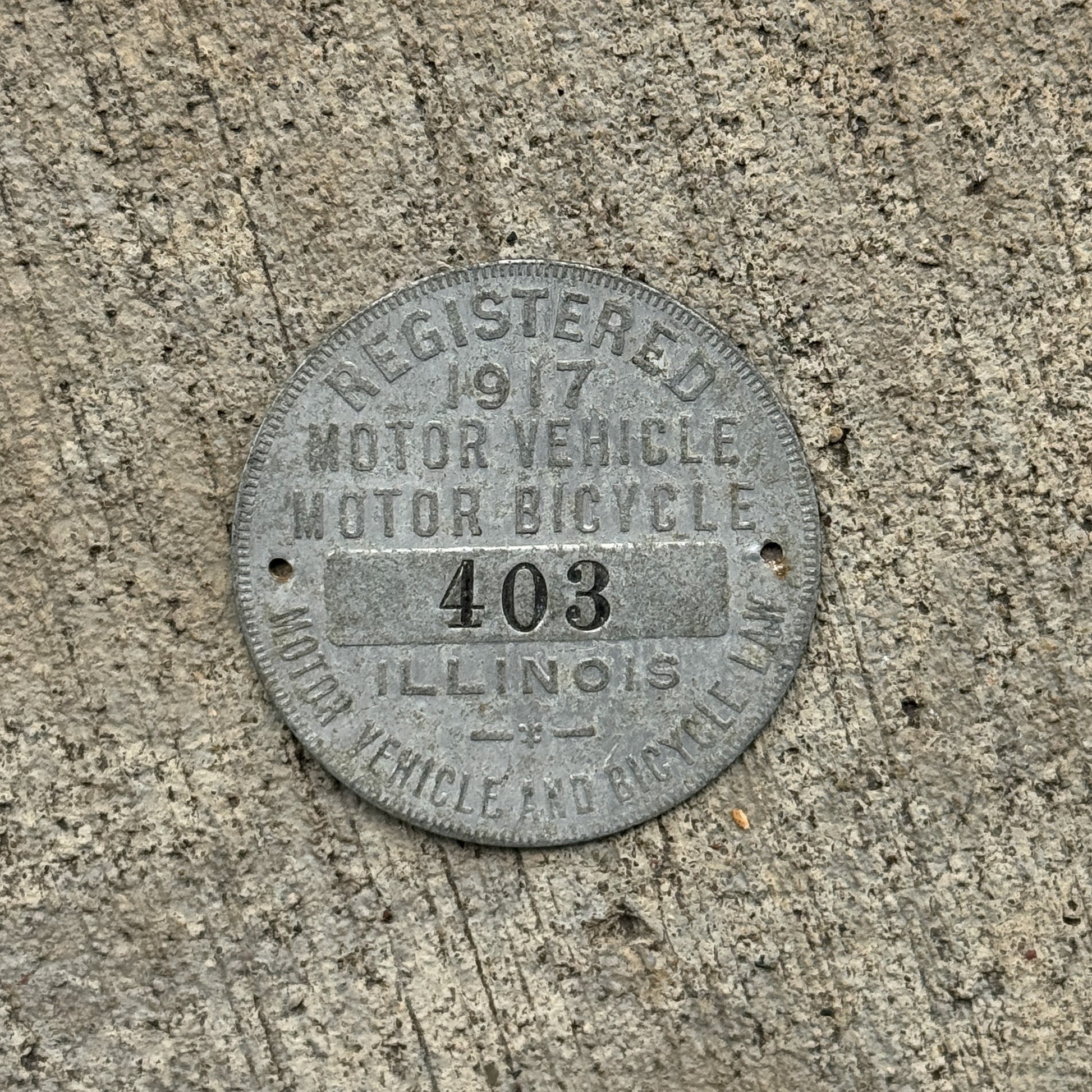 Photo of a 1917 Illinois Dashboard Disc Auto Tag Garage Decor Vintage Dash Disk Low Number Three Digit 403 with original patina
