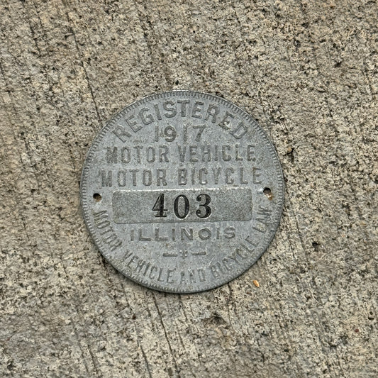 Photo of a 1917 Illinois Dashboard Disc Auto Tag Garage Decor Vintage Dash Disk Low Number Three Digit 403 with original patina
