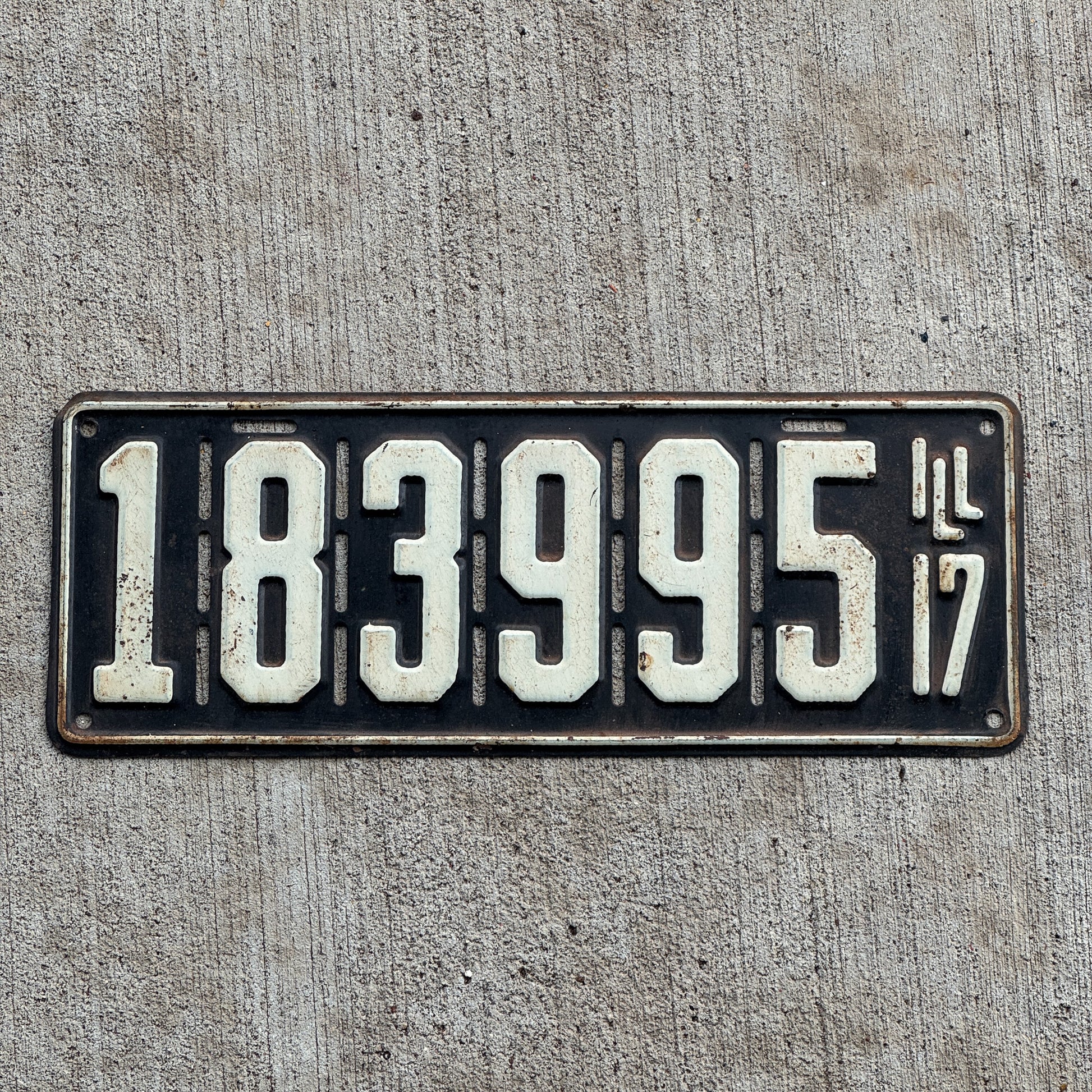 Photo of a 1917 Illinois License Plate Auto Tag Garage Decor Vintage 183 995 with original patina