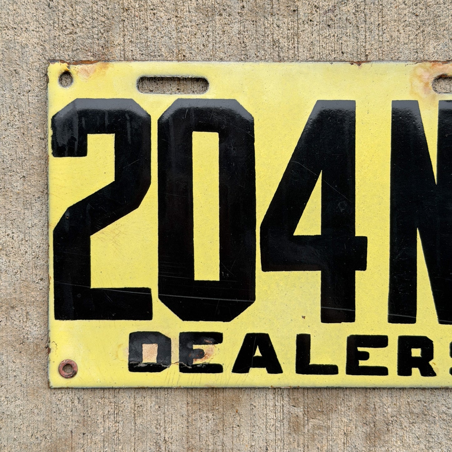 Photo of a 1917 New Brunswick Porcelain Dealer License Plate Auto Tag Garage Decor Vintage High Quality 204 with original patina
