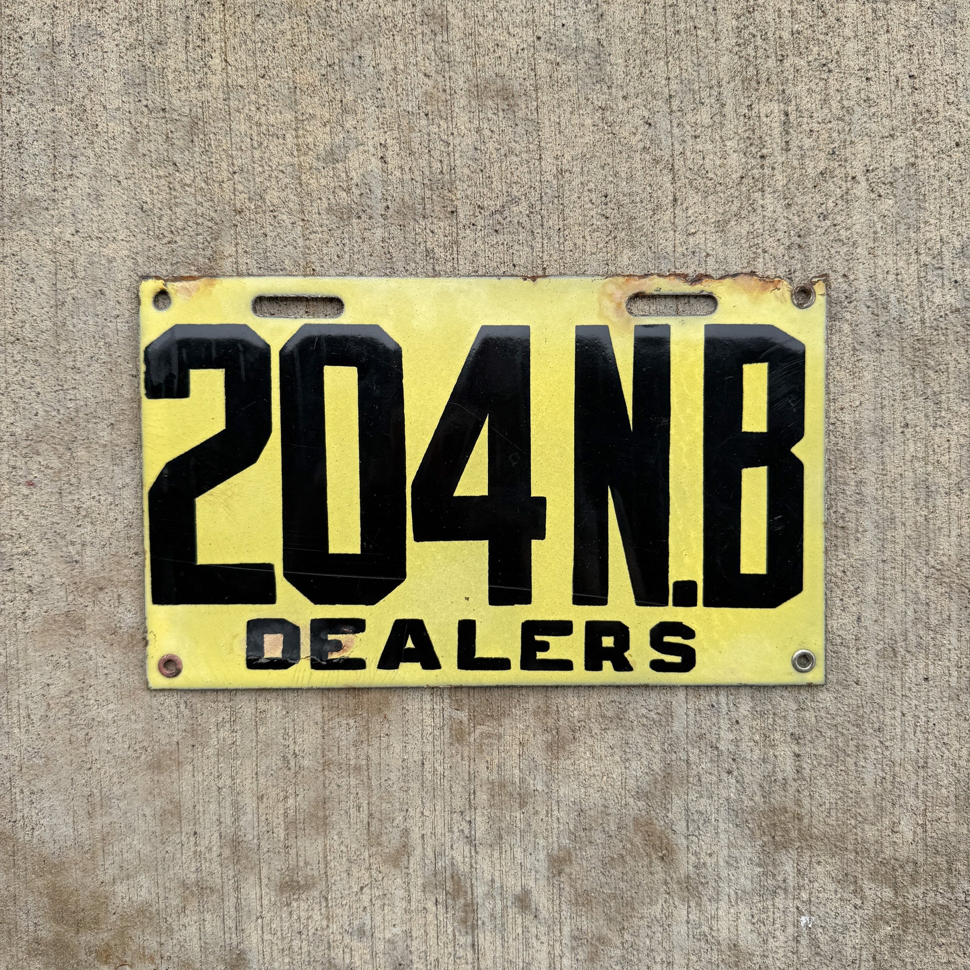Photo of a 1917 New Brunswick Porcelain Dealer License Plate Auto Tag Garage Decor Vintage High Quality 204 with original patina