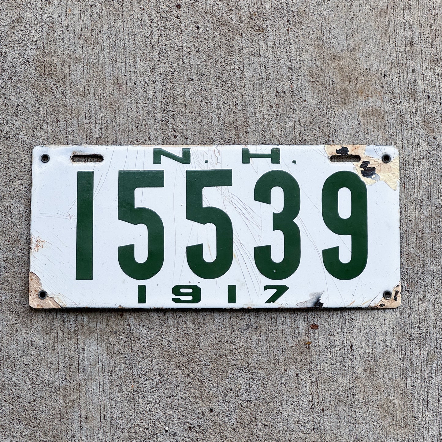 Photo of a 1917 New Hampshire Porcelain License Plate Auto Tag Garage Decor Vintage 15539 with original patina