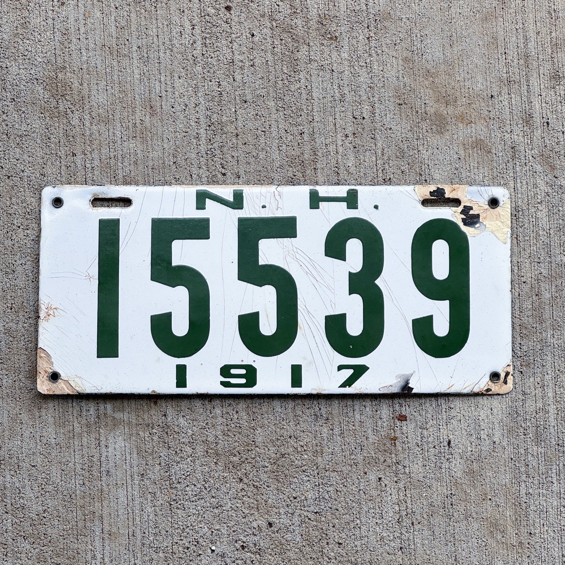 Photo of a 1917 New Hampshire Porcelain License Plate Auto Tag Garage Decor Vintage 15539 with original patina