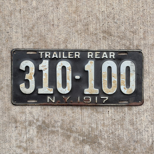 Photo of a 1917 New York Trailer License Plate Auto Tag Garage Decor Vintage Hard to Find Type 310 100 with original patina