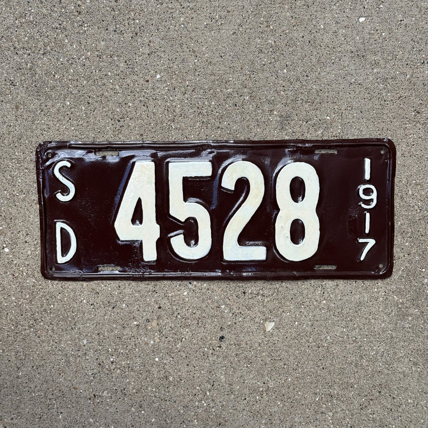 Photo of a 1917 South Dakota License Plate Auto Tag Garage Decor Vintage Four Digit 4528