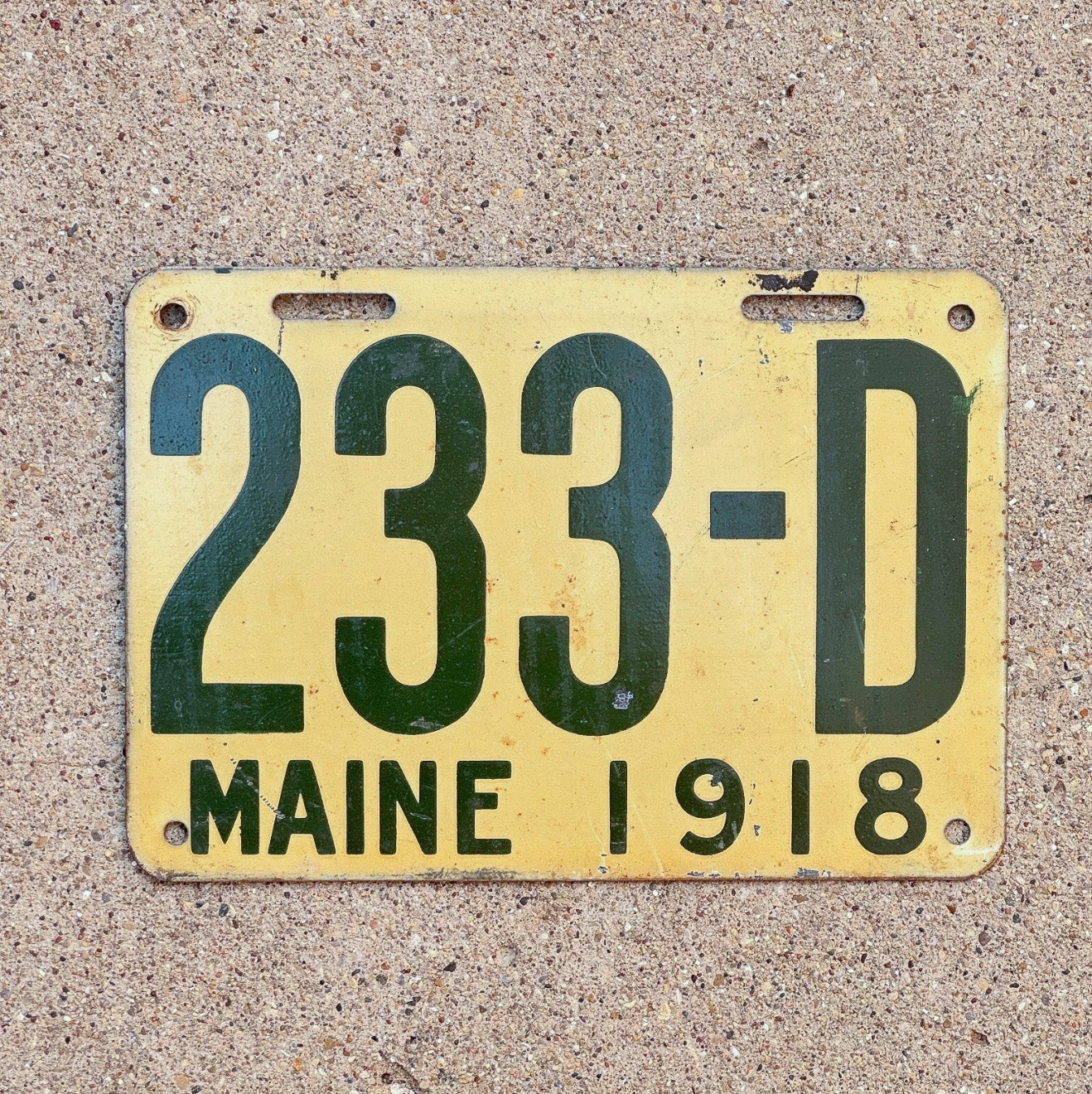Photo of a 1918 Maine Dealer License Plate Auto Tag Garage Decor Vintage 233 D with original patina