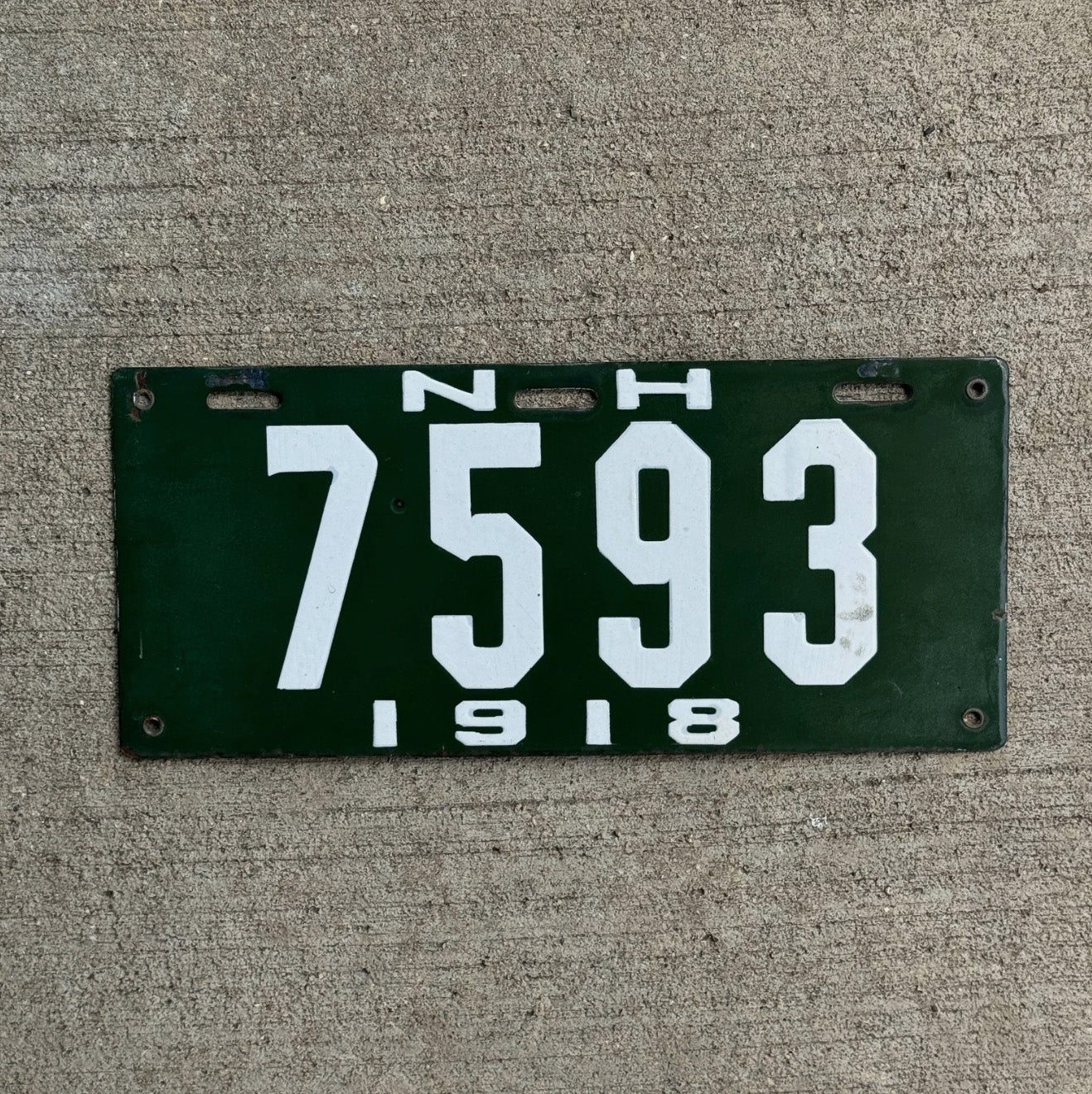 Photo of a 1918 New Hampshire Porcelain License Plate Auto Tag Garage Decor Vintage High Quality Low Number Four Digit 7593 with original patina