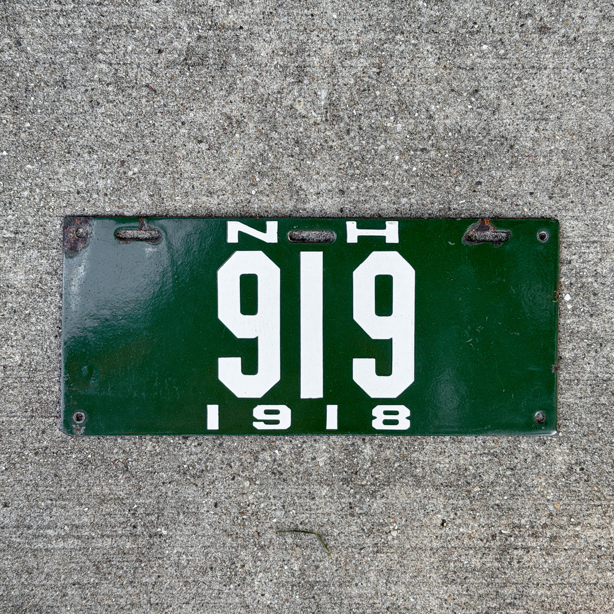 Photo of a 1918 New Hampshire Porcelain License Plate Auto Tag Garage Decor Vintage Low Number Three Digit 919 with original patina