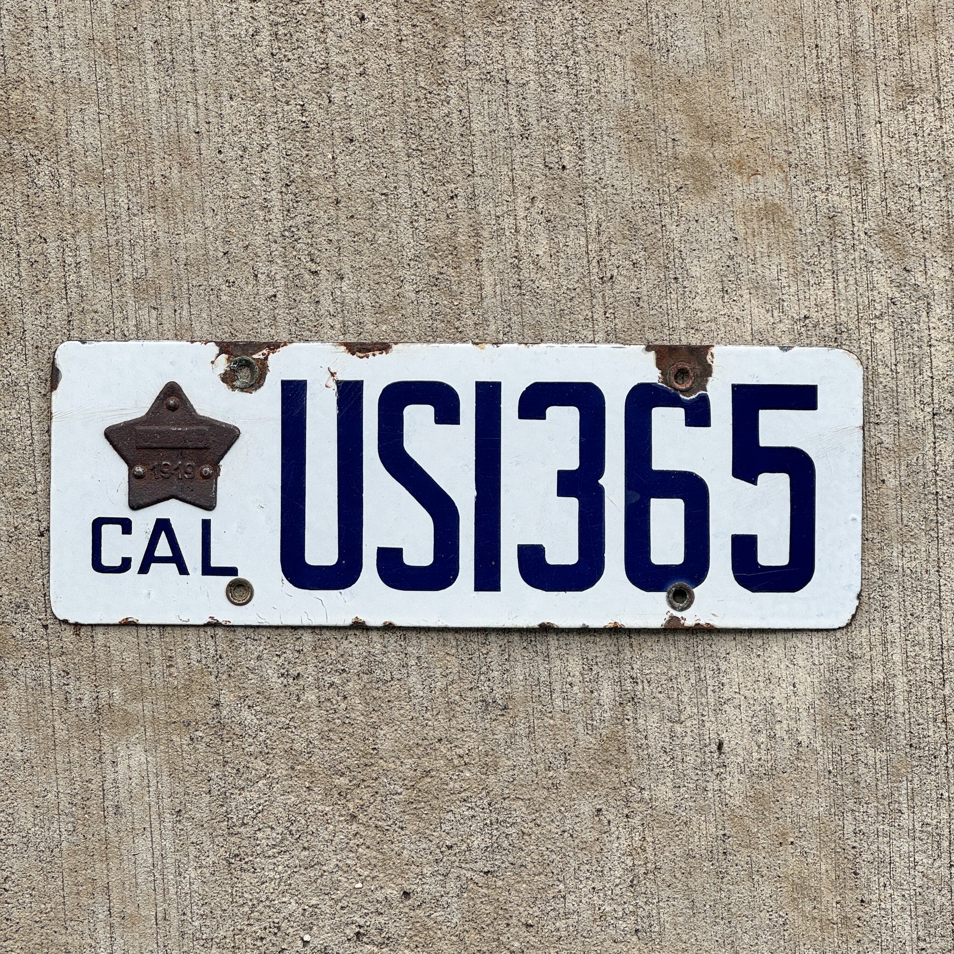 Photo of a 1919 California Porcelain US Government License Plate Auto Tag Garage Decor Vintage High Quality US 1365 with original patina