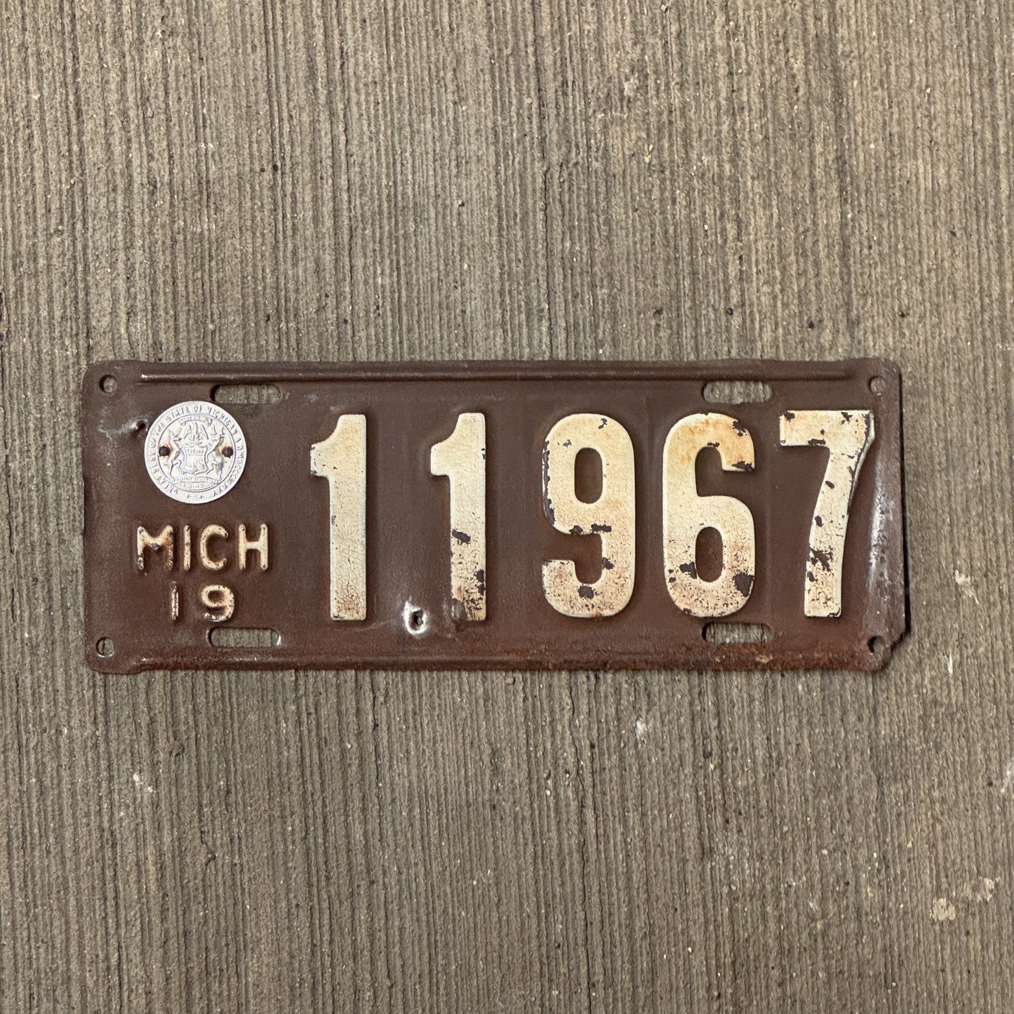 Photo of a 1919 Michigan License Plate Auto Tag Garage Decor Vintage Extra holes at bottom edge and near seal 11967