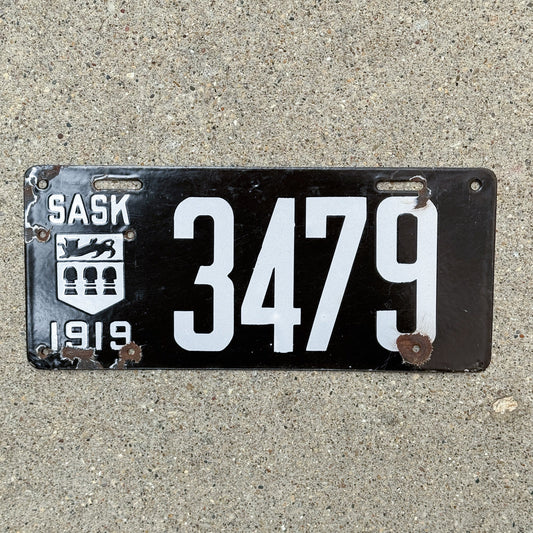 Photo of a 1919 Saskatchewan Porcelain License Plate Auto Tag Garage Decor Vintage 3479 with original patina