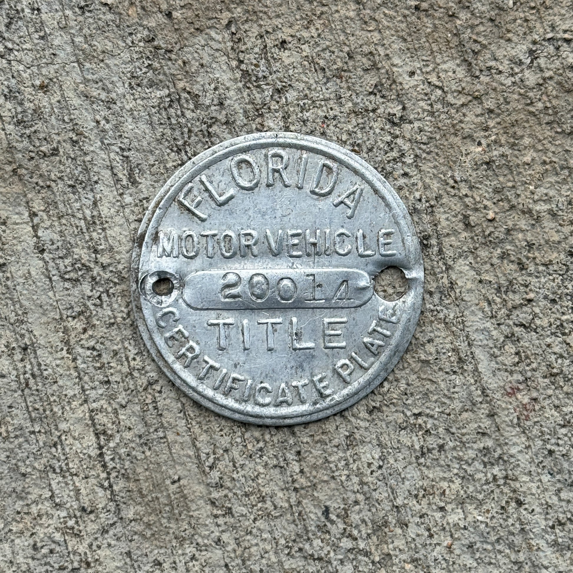 Photo of a 1920 Era Florida Dashboard Disc Auto Tag Garage Decor Vintage Dash Disk 20014 with original patina