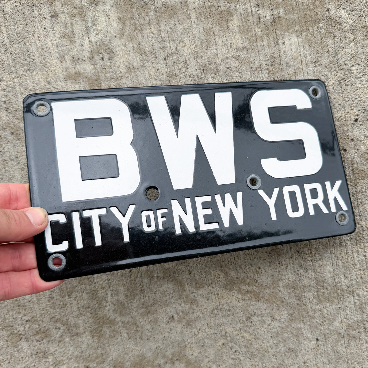 Photo of a 1920 Era New York Porcelain License Plate Auto Tag Garage Decor Vintage New York City Bureau of Water Supply BWS with original patina